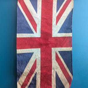 WWII period cotton vintage Union Jack flag on wooden pole