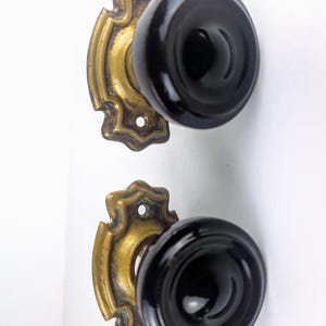 Antique Edwardian door knobs with brass back plates