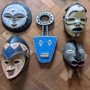 Collection of five mid 20th century African masks