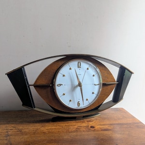 Midcentury Metamec teak and gold eye shape mantel clock with new battery movement