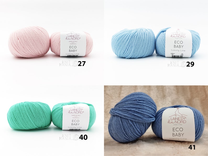 May include: Four skeins of yarn in different colors: pink, light blue, green, and blue. Each skein has a label that reads "Laines du Nord Eco Baby Luxury Line".