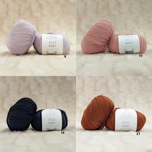 May include: Four skeins of yarn in different colors: light purple, light pink, dark gray, and brown. Each skein has a white label with the text "Laines &  Nord Eco Baby Luxury Line" and a number: 8, 10, 18, and 21.