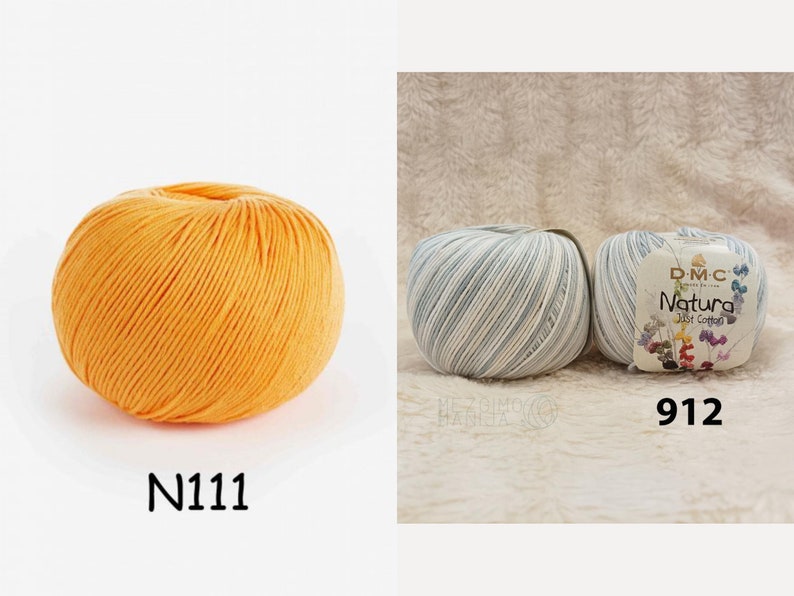 May include: Two balls of yarn, one orange and one blue and white striped. The orange ball is labelled N1111. The blue and white ball is labelled 912 and DMC Natura Just Cotton.