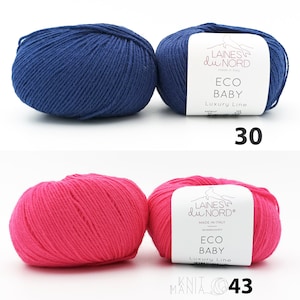 May include: Two skeins of yarn, one blue and one pink, labeled "Laines du Nord Eco Baby Luxury Line". The blue skein is labeled "30" and the pink skein is labeled "43".