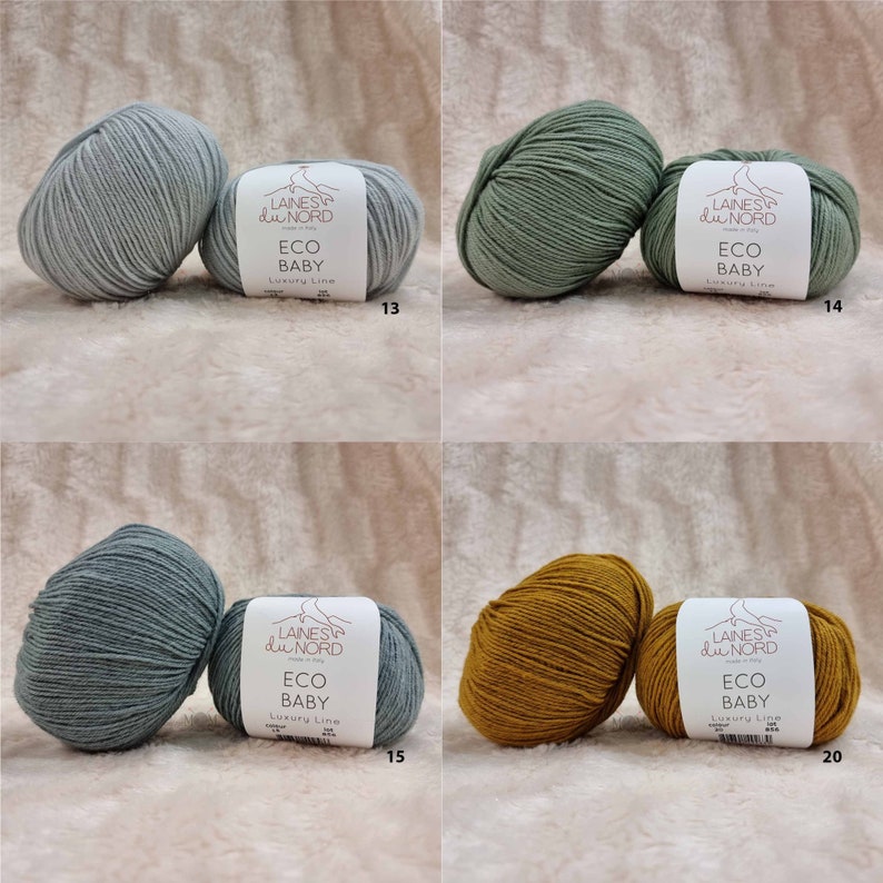 May include: Four balls of yarn in different colors: light blue, green, blue-green, and mustard yellow. Each ball has a label that reads "LAINES du NORD ECO BABY Luxury Line" with a number underneath.