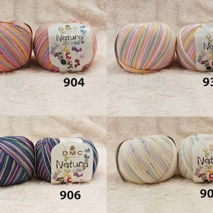 May include: Four balls of DMC Natura Just Cotton yarn in various colour combinations. The balls are arranged in two rows of two. The colours include pink, yellow, blue, green, white, and purple.