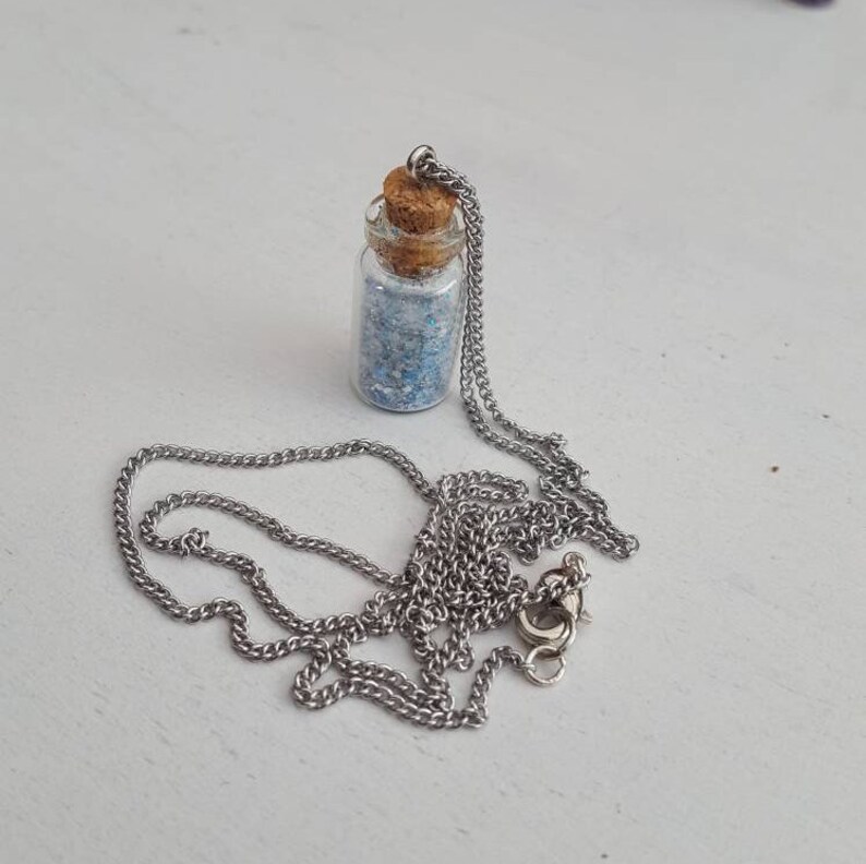 Whiteblue stardust necklace.