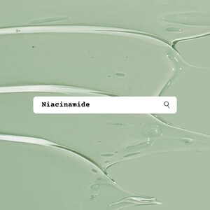 May include: A close-up of a green liquid with a white search bar that says "Niacinamide" with a magnifying glass icon.