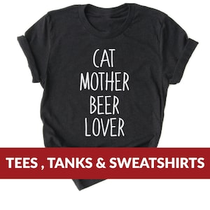 Może przedstawiać: Czarny T-shirt z białym tekstem, kt&oacute;ry brzmi "Cat Mother Beer Lover". Koszulki, Tanki i Bluzy.