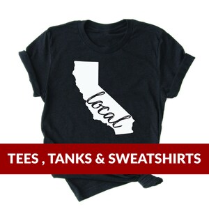 May include: Black t-shirt with a white outline of the state of California and the word "local" written inside the state.  The t-shirt is available in tees, tanks, and sweatshirts.