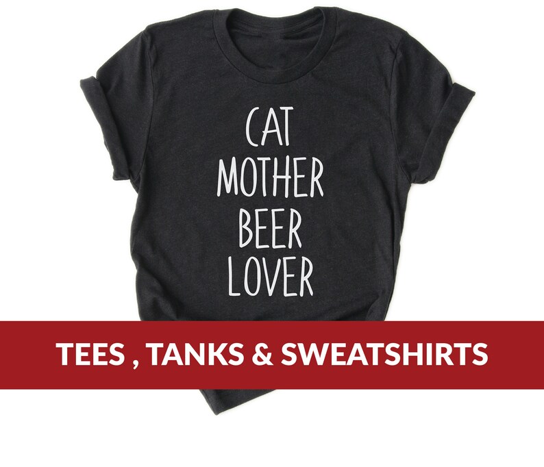Może przedstawiać: Czarny T-shirt z białym tekstem, kt&oacute;ry brzmi "Cat Mother Beer Lover". Koszulki, Tanki i Bluzy.