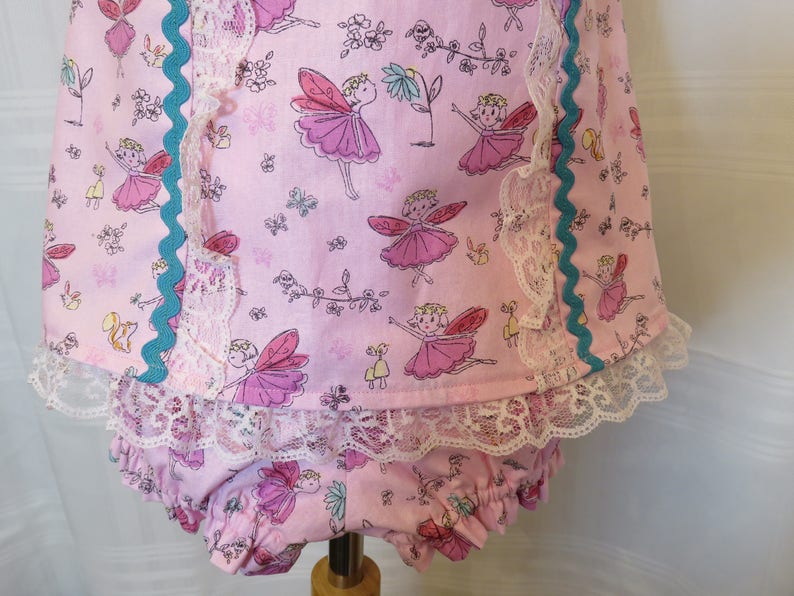 Playful Baby Girl Dress in a Pink Fairy Print with Matching Panties and Hat