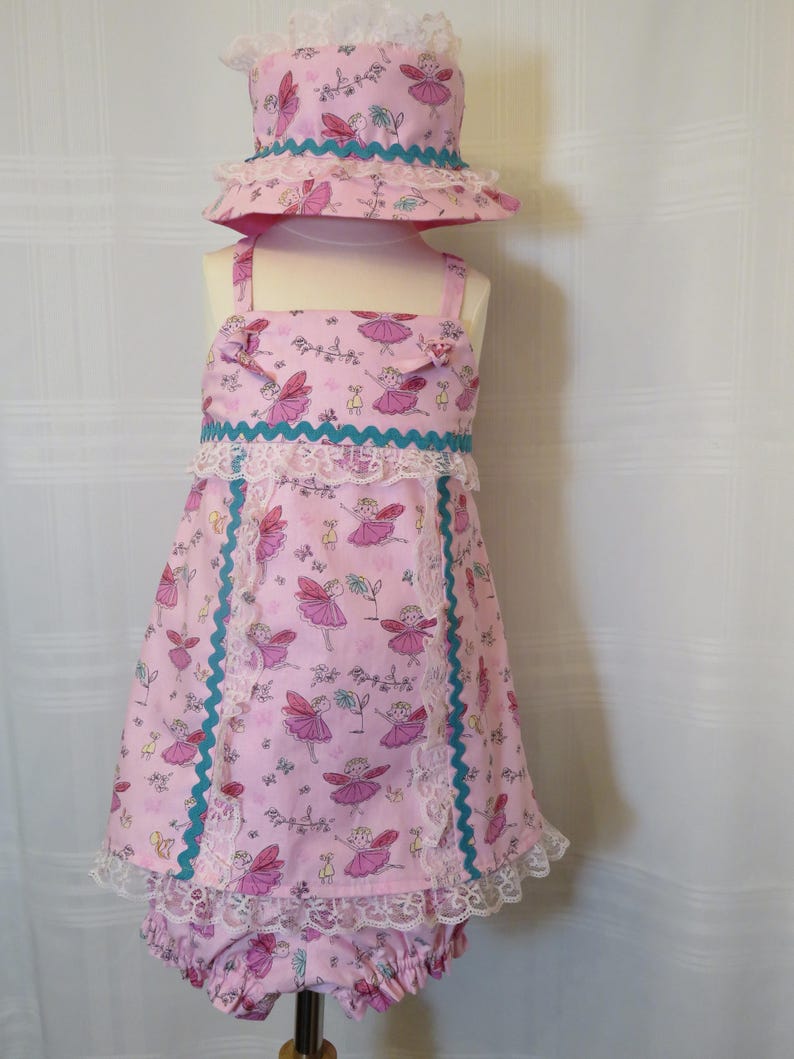 Playful Baby Girl Dress in a Pink Fairy Print with Matching Panties and Hat