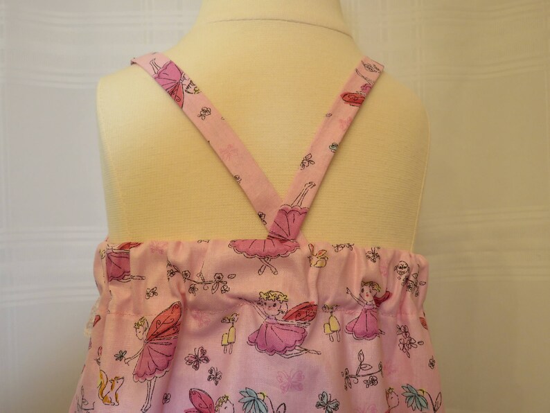 Playful Baby Girl Dress in a Pink Fairy Print with Matching Panties and Hat