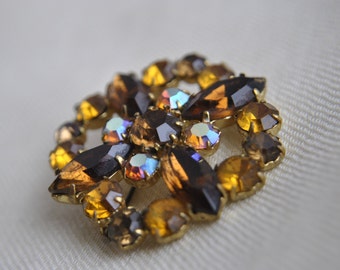 Ornate Czech vintage brooch with bright amber-colored crystalswhich, have survived from 1960-1970
