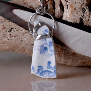 Broken china necklace light blue and white floral triangle shaped pendant with gold edging. Vintage antique china handmade soldered upcycled