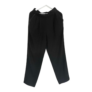 Vintage black loose fit high waisted trousers by Hemmels. M