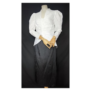 80s vintage white puffed sleeve blouse and black skirt by Radley London. S/M