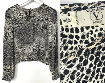 Vintage 90's Valentino Miss V black and white silk blouse. Animal print top with green buttons on the back. Designer Valentino silk top. S