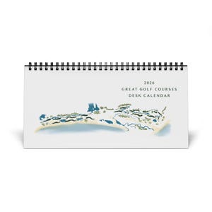 May include: A 2026 desk calendar with a spiral binding, showcasing a watercolor map of a golf course. The text reads "GREAT GOLF COURSES DESK CALENDAR". The design incorporates blue, green, and beige hues, offering a scenic view.