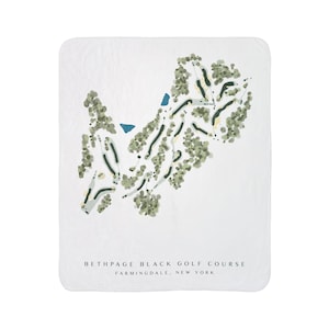May include: White blanket featuring a detailed map of Bethpage Black Golf Course in Farmingdale, New York. The map includes green fairways, trees, and water features in shades of green and blue. Text at the bottom reads "Bethpage Black Golf Course, Farmingdale, New York."