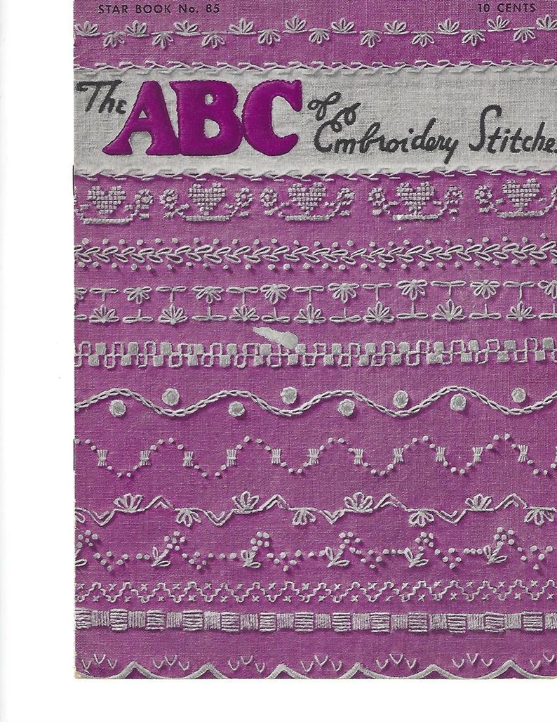May include: A purple booklet with the title "The ABC of Embroidery Stitches" in white lettering. The cover features a variety of embroidery stitches in white thread on a purple background.
