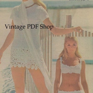 May include: Two women wearing white crochet dresses. The woman on the left is wearing a long dress with a deep border of flowers and leaves. The woman on the right is wearing a bikini top and bottom. The text "Vintage PDF Shop" is at the top of the image. The text "Beach dress, dazzling in white, combines openwork crochet with a deep border of flowers and leaves. Matching bikini, to sew or buy, is encrusted with the same daisies and roses. Directions on page 42." is at the top right of the image.