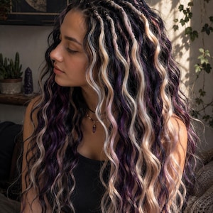 May include: Long, wavy hair extensions featuring a blend of deep purple, black, and platinum blonde strands. The hair is styled with several small, tightly wrapped braids at the crown, transitioning into loose, voluminous, flowing waves.