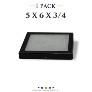 May include: A black display box with a clear window, measuring 5 x 6 x 3/4 inches. The text "-1 PACK-" and the dimensions are displayed above the box. The bottom of the image reads "PROUDLY MADE IN U.S.A."