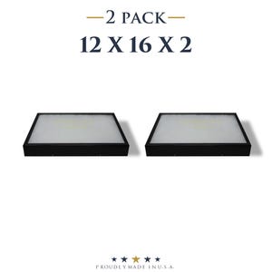 May include: Two black framed objects with a white interior, each measuring 12 x 16 inches. The text "-2 PACK-" and "12 X 16 X 2" is displayed above the objects. The phrase "PROUDLY MADE IN U.S.A." is at the bottom.