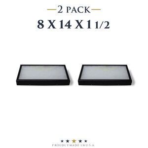 May include: Two black rectangular display cases, each measuring 8 x 14 x 1 1/2 inches, are shown. The cases have a white interior and are set against a white background. The text "-2 PACK-" and the dimensions are displayed above the cases.