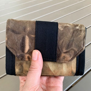 Compact size purse with 4 card holder slots, two small notes sections and a zippered pocket.  Australian Handmade.