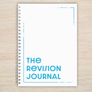 May include: White spiral bound journal with the text "THE REVISION JOURNAL" in blue.
