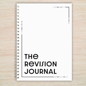 May include: A white spiral bound journal with the text "THE REVISION JOURNAL" printed in black.
