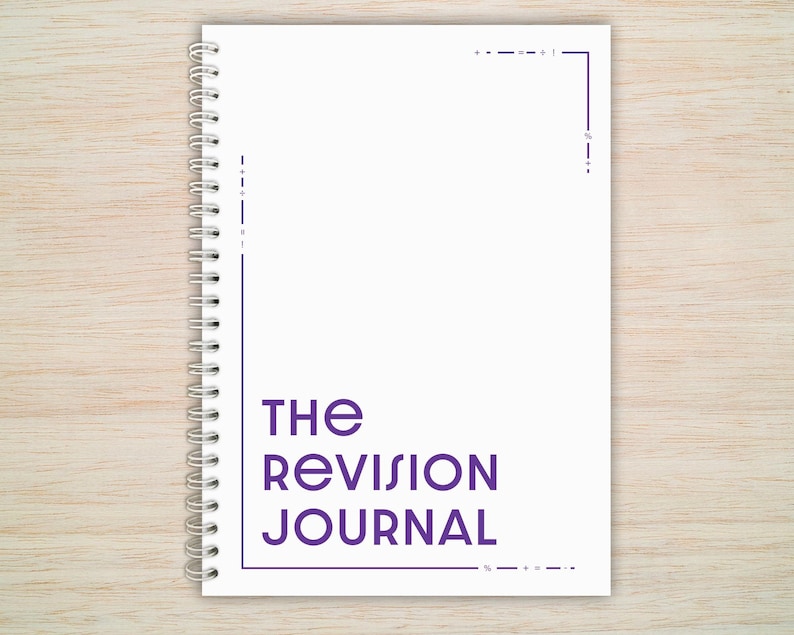 May include: A white spiral bound journal with the text "THE REVISION JOURNAL" in purple lettering.