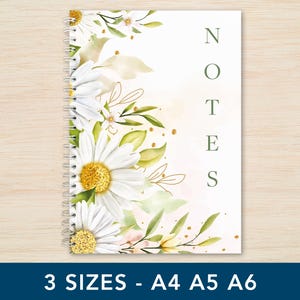 May include: A floral notebook with a spiral binding. The cover is adorned with white daisies, yellow centers, and green foliage. The word "NOTES" is printed vertically. Available in A4, A5, and A6 sizes, the notebook is ideal for note-taking.