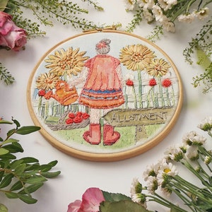 May include: Embroidered hoop art featuring a girl in a red dress holding a watering can in a garden setting with sunflowers and a sign that reads "Allotment".