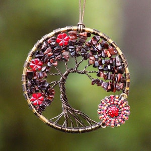 Act with confidence, strength, clarity, and enthusiasm. Red tiger’s eye, crystal beaded, Tree Of Life Decor, flower charms