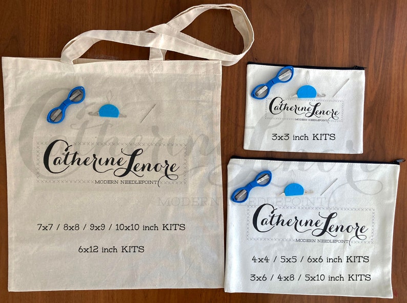 May include: Three white canvas bags with black zipper closures and black text. The largest bag has the text "Catherine Lenore Modern Needlepoint" and lists sizes "7x7 / 8x8 / 9x9 / 10x10 inch KITS" and "6x12 inch KITS". The medium bag has the text "Catherine Lenore Modern Needlepoint" and lists sizes "4x4 / 5x5 / 6x6 inch KITS" and "3x6 / 4x8 / 5x10 inch KITS". The smallest bag has the text "Catherine Lenore Modern Needlepoint" and lists sizes "3x3 inch KITS".