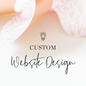 May include: A white background with a light pink flower petal in the background. The text "CUSTOM website Design" is in black text with a lightbulb icon above the text.