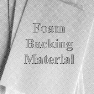 May include: A stack of white foam backing material sheets. The text "Foam Backing Material" is printed in a gray, serif font on the top sheet. The image is in black and white.