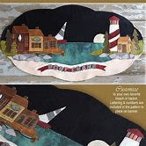 May include: A felt applique pattern for a lighthouse scene with a sailboat, houses, and the text "Safe Harbor". The pattern is on a black background with a blue and green water scene.