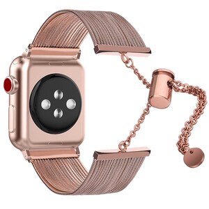 May include: Rose gold Apple Watch band with a chain and a magnetic clasp. The band is made of a woven metal mesh.