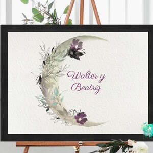 May include: A watercolor painting of a crescent moon with floral details in shades of purple, green, and gray. The text "Walter y Beatriz" is written in purple script below the moon.