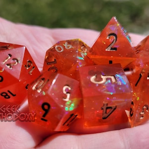 Sharp Edge Dice - Full Set with Inclusions - Orange Polyhedral Dice Set -- Electric Marmalade