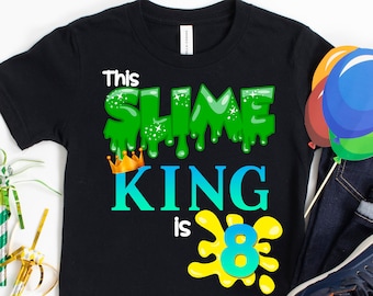 May include: Black t-shirt with green slime dripping down, a gold crown, and the text "This Slime King is 8".