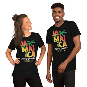 May include: Two people wearing black t-shirts with a graphic design of palm trees and the text "Jamaica Family Vacation 2022".