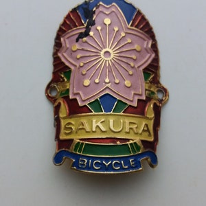Used SAKURA aluminum embossed Head Badge Emblem For Vintage Bicycle