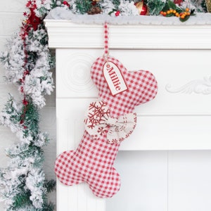 A product display image of a personalized pet stocking with a red plaid pattern