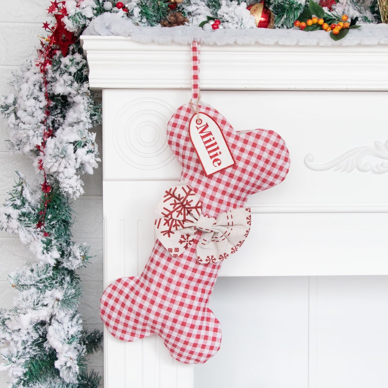 A product display image of a personalized pet stocking with a red plaid pattern